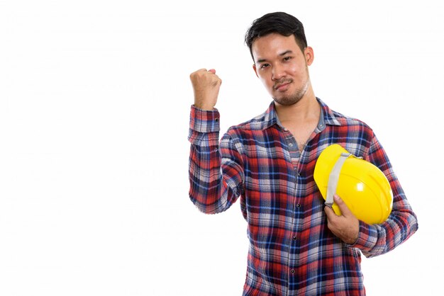  young Asian man construction worker holding safet