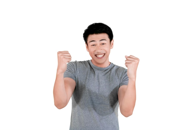 Young Asian man expressing happy on studio