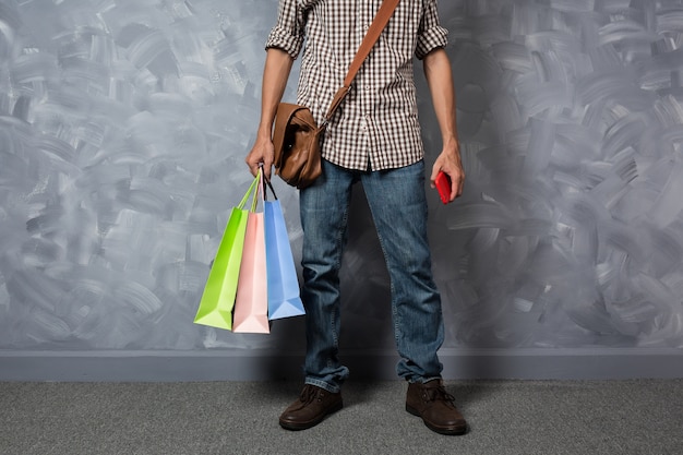 Young asian man hold shopping bag