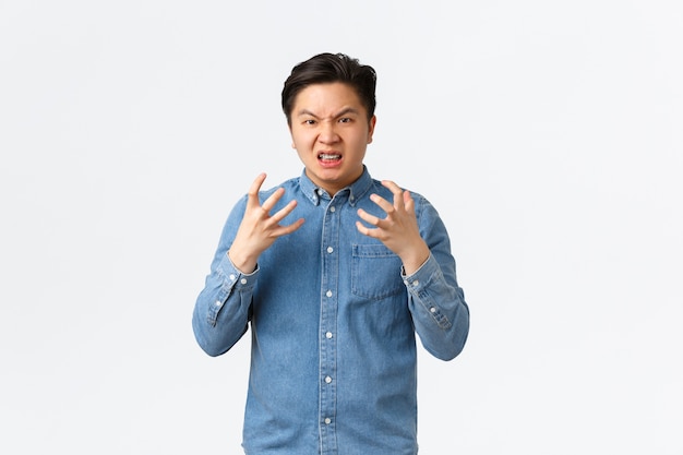 Young Asian man posing in the studio