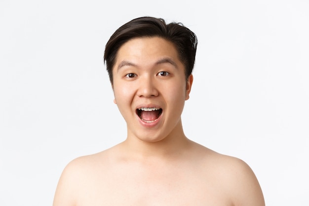 Young Asian man posing in the studio