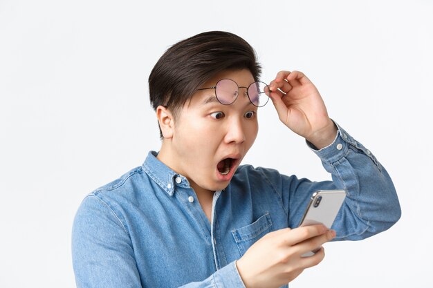 Young Asian man in shirt posing