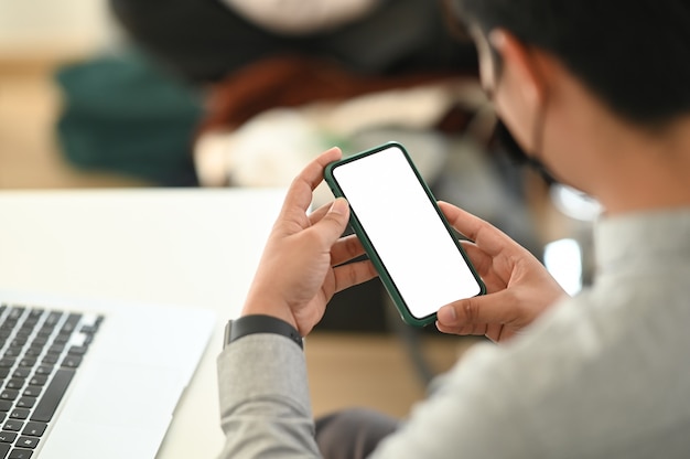 Young Asian man using a smartphone