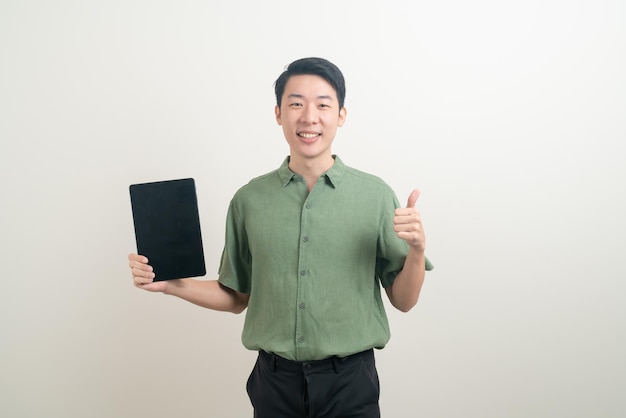 Young Asian man using tablet