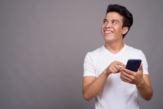 young Asian man wearing white shirt 