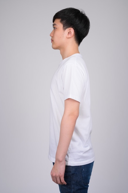 young Asian man on white