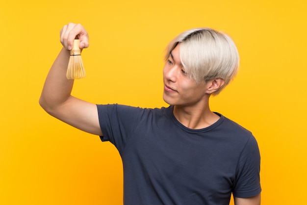 Young asian man with matcha tea