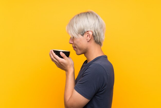 Young asian man with matcha tea