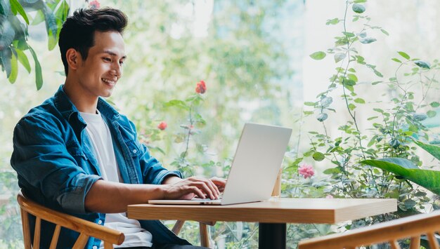 Young Asian man working at coffee shop