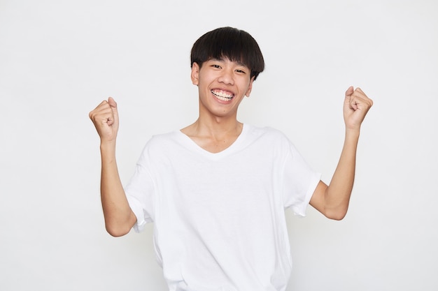 Young Asian men are happy and excited on white surface