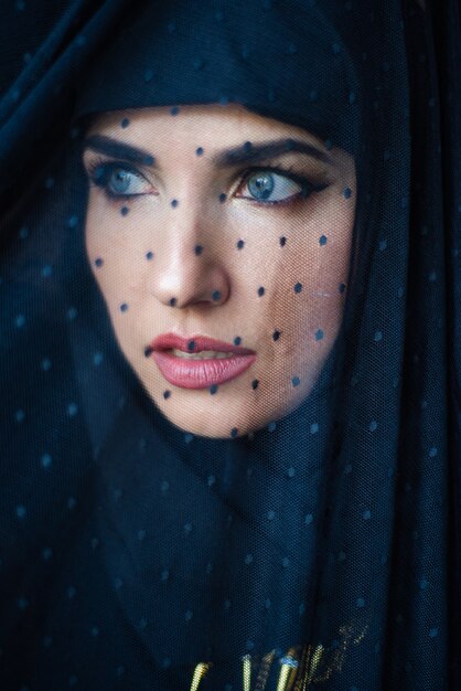 Young asian muslim woman in head scarf smile Beautiful middle eastern woman wearing abaya Arabian