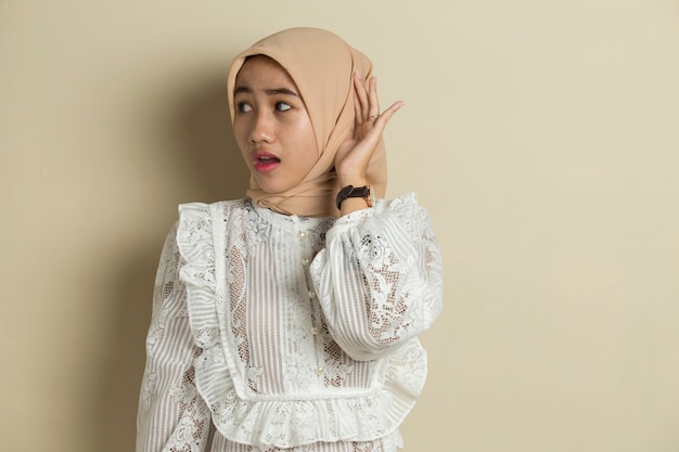 Young Asian muslim women with hijab are listening