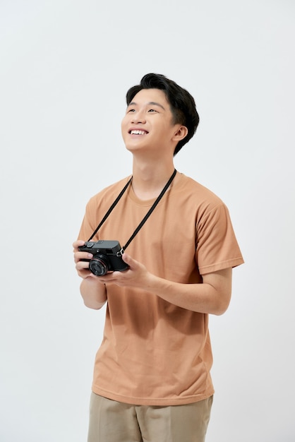 Young Asian photographer in a brown t-shirt