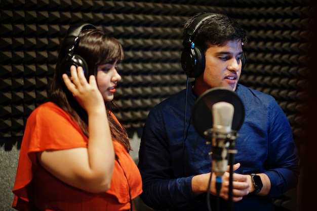 Young Asian singers recording in the studio