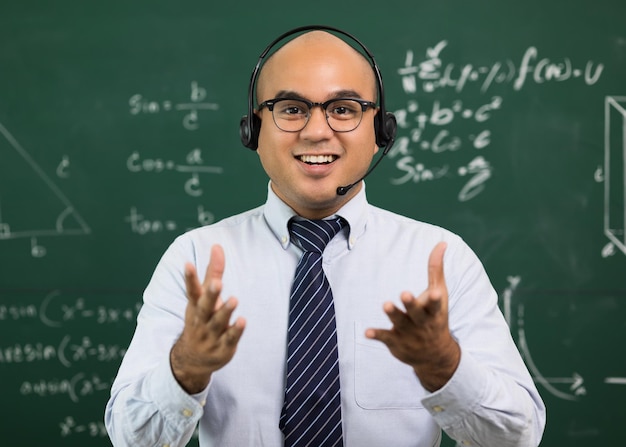 Young asian teacher man teaching video conference with\
student