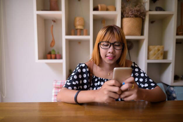 Young Asian teenage girl relaxing at home