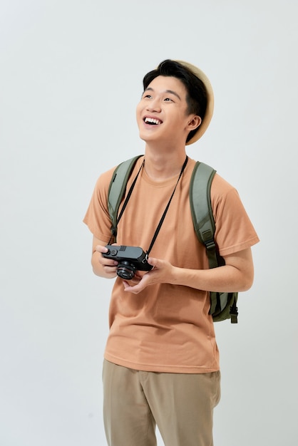 Young Asian tourist in a brown t-shirt