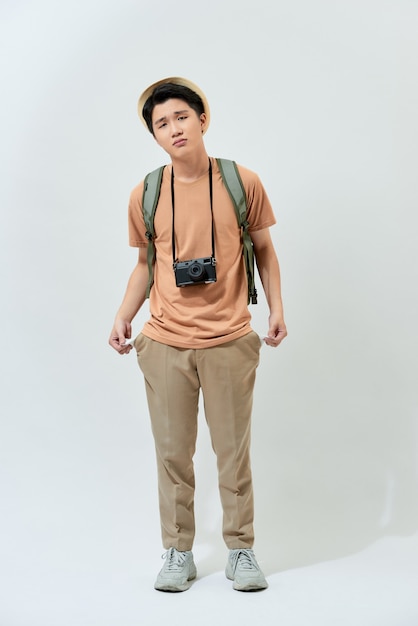 Young Asian tourist in a brown t-shirt