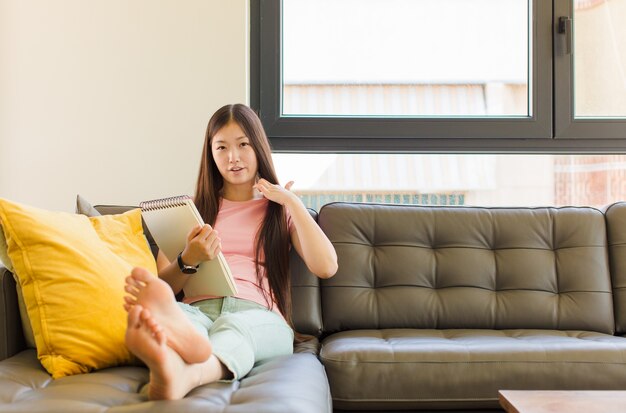 Young asian woman feeling stressed, anxious, tired and frustrated, pulling shirt neck, looking frustrated with problem