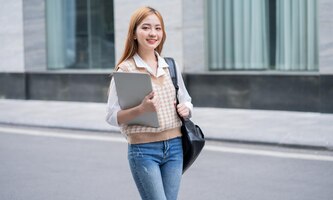 Young asian woman going to work