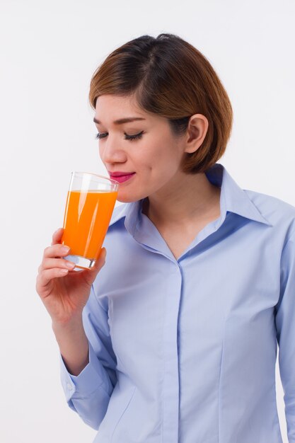 Young Asian woman holding a glass