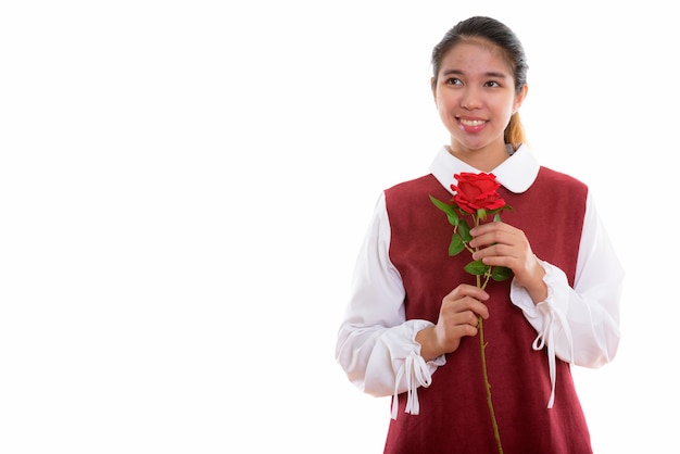 young Asian woman holding red rose