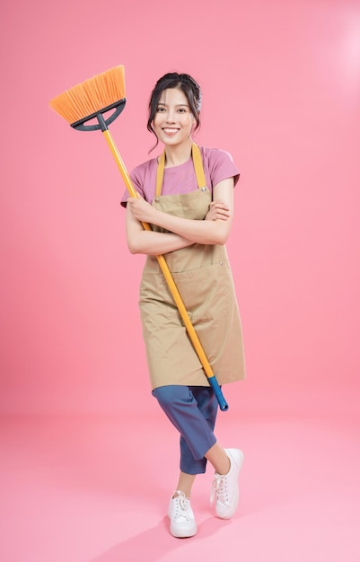 Young asian woman housewife on background