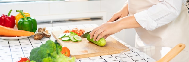Young Asian woman is preparing healthy food vegetable salad