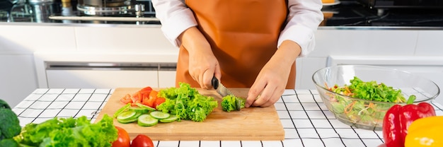 Young Asian woman is preparing healthy food vegetable salad