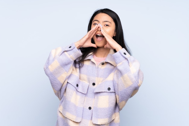 Young asian woman over isolated background