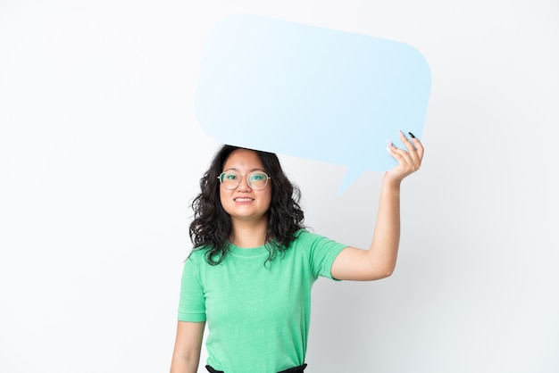 Photo young asian woman isolated on white background holding an empty speech bubble