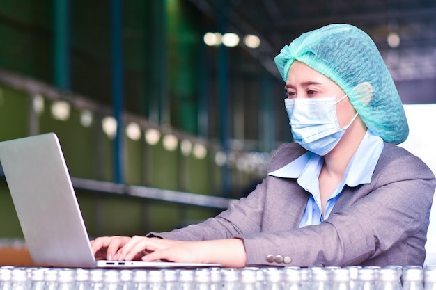 Young asian woman manager or trainee staff work and checks the number of items store by Computer technology. Asian owner or small business concept.