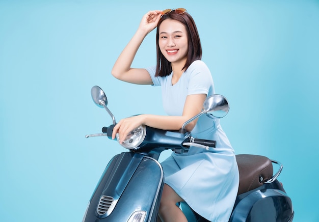 Young Asian woman on motorbike