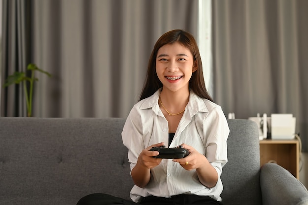 Young Asian woman playing video games