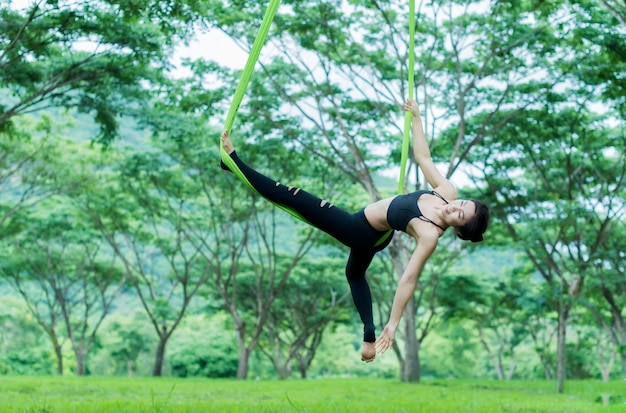 Young asian woman practicing yoga together