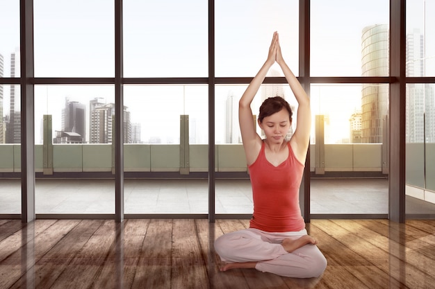 Young asian woman practicing yoga