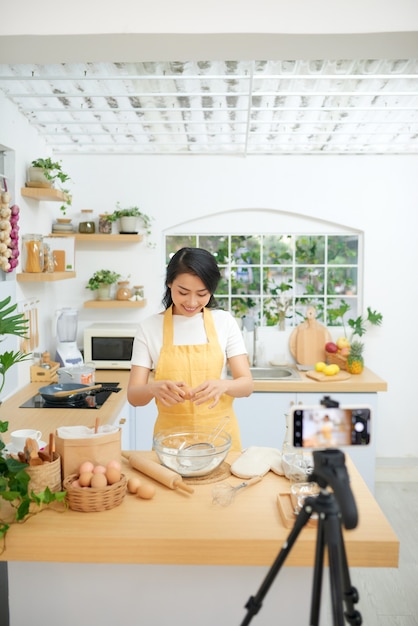 Young asian woman recording video for her blog