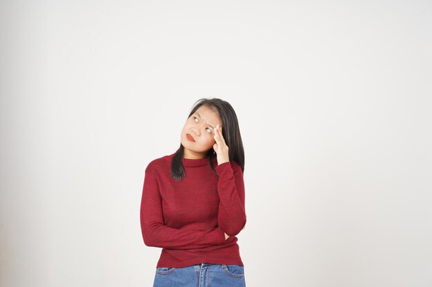 Young Asian woman in Red tshirt thoughtful thinking gesture isolated on white background