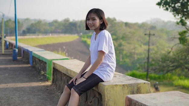 Young asian woman resting after a jogging