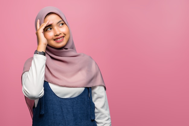 Young asian woman smiling and looking up