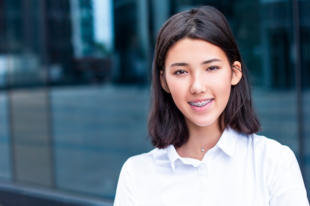 Young asian woman smiling and looking.