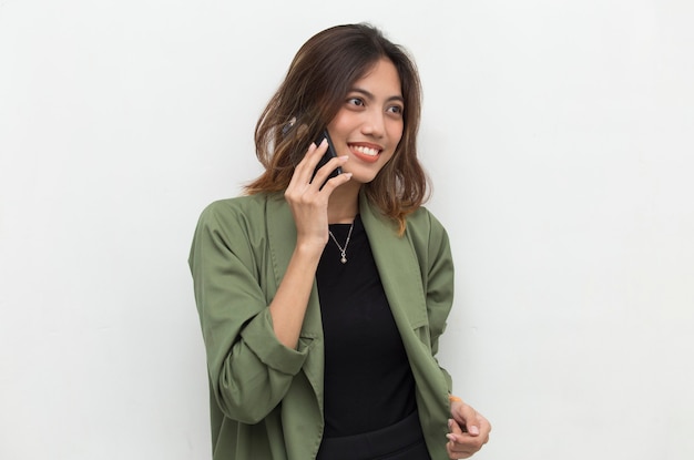 Young asian woman speaking on the phone