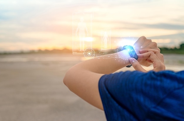 Young Asian woman touching smart band after running in the morning Wearable computer Heart rate