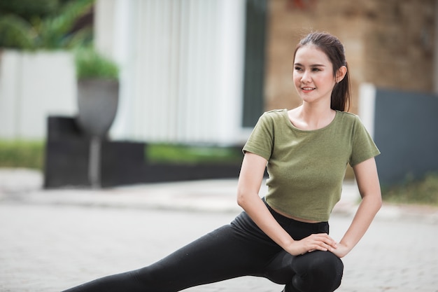 Young asian woman warm up and exercising