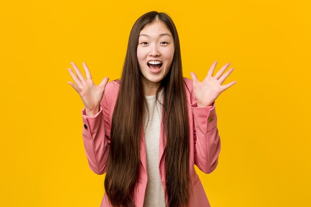 Young asian woman wearing a business suit