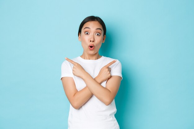 Young Asian woman wearing casual T-shirt posing