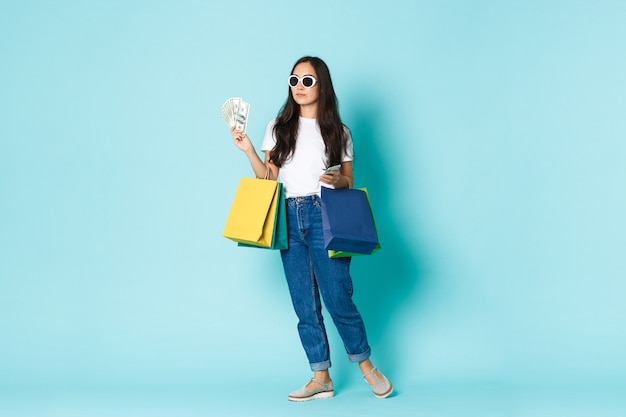 Young Asian woman wearing casual T-shirt posing