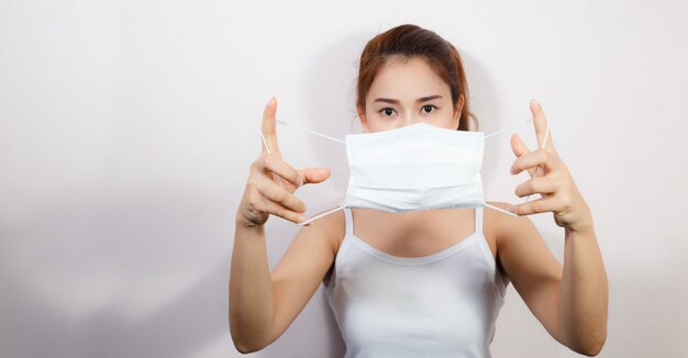 Young Asian woman wearing a mask to prevent germs