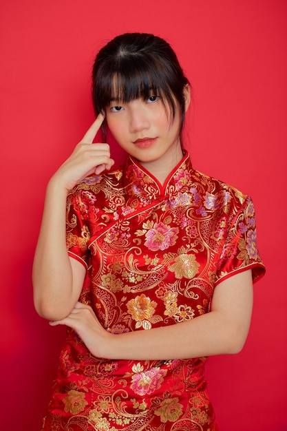 Young Asian woman wearing a traditional cheongsam