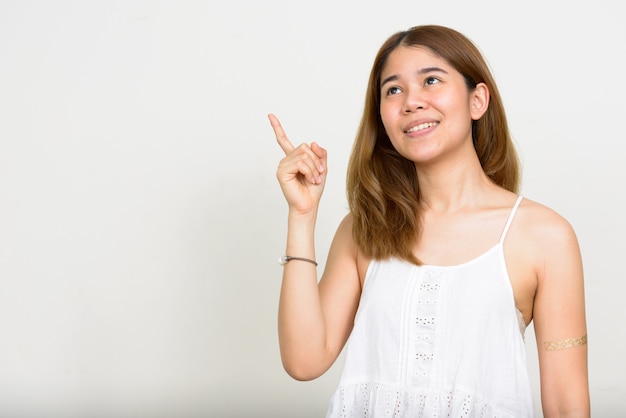 young Asian woman on white